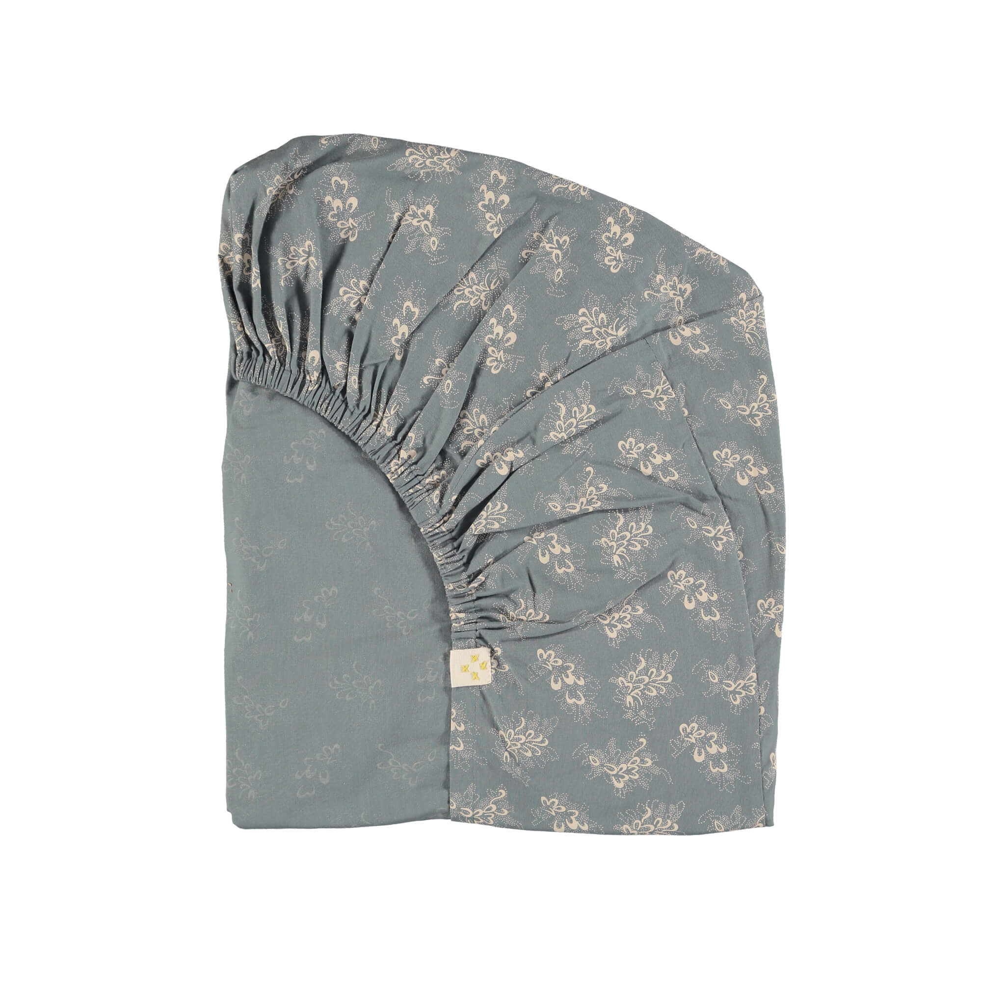 Celia soft blue fitted sheet with stone floral print organic cotton with elasticated ends camomile london