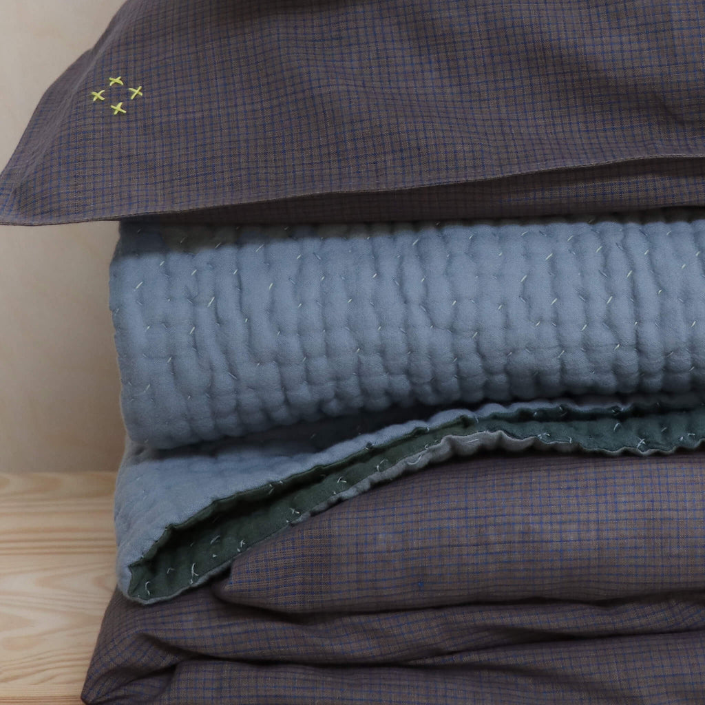 unisex check bedding by camomile london in mocca and blue.