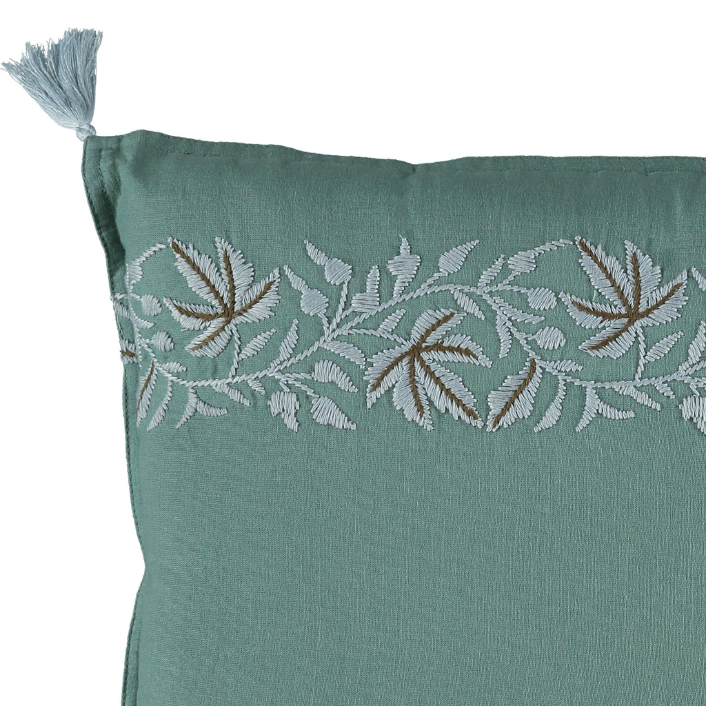 Pale blue botanical ivy leaf embroidery on a Teal green padded cushion by camomile london