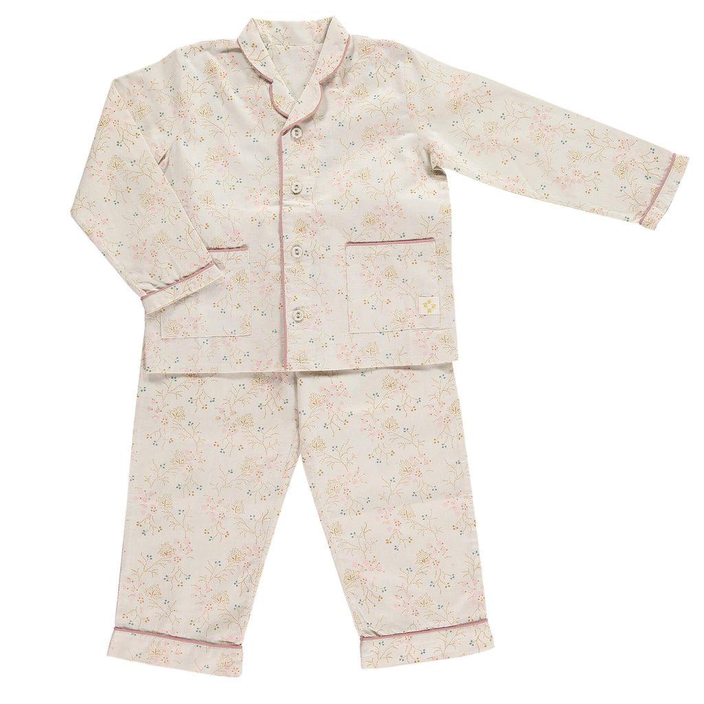 Girls 100% soft cotton pyjamas with beautiful piping detail and front pockets, comes in a muslin bag for storage or gifting printed in Minako golden by camomile london