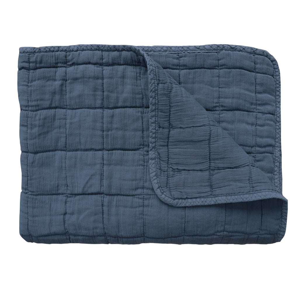 Square quilted blanket in royal navy 100% soft cotton gauze and lightly wadded comes in 4 different sizes bedding by camomile london