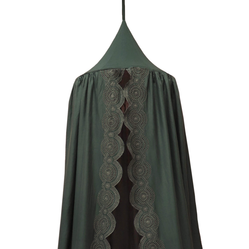 Soft cotton gauze canopy in dark green with intricate broderie anglais edging, hand cut by skilled artisans. Made by camomile london.