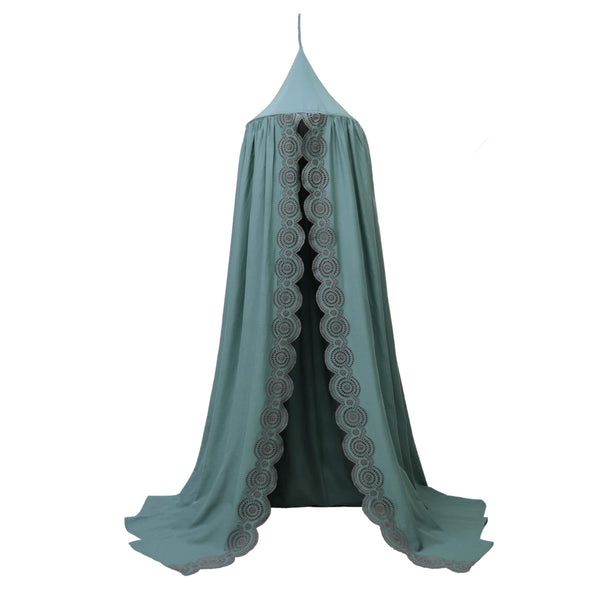 Soft cotton gauze canopy in teal with intricate broderie anglais edging, hand cut by skilled artisans. Made by camomile london.