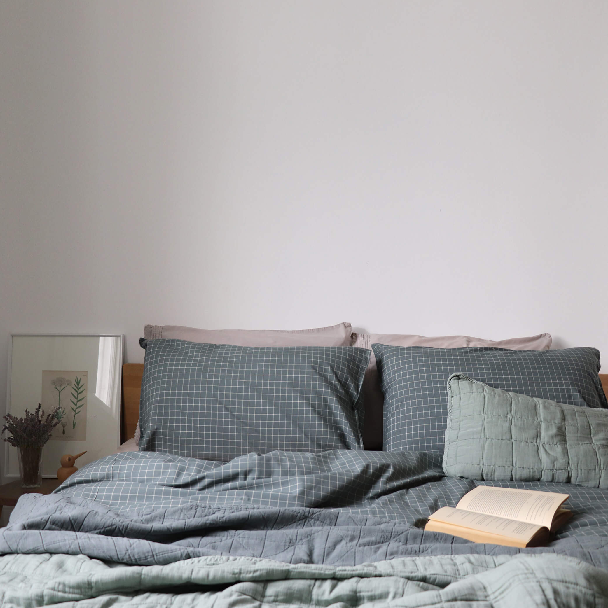 Square quilted blanket in sage 100% soft cotton gauze and lightly filled with anti-allergy polyester comes in 4 different sizes with matching pillow cases available and can be mixed with our beautiful Window Pane check bedding in teal and stone by camomile london